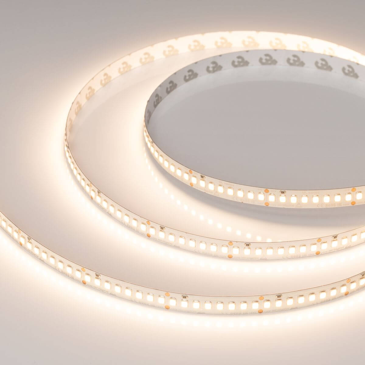 

Светодиодная лента Arlight 20W/m 200LED/m 2835SMD теплый белый 5M UL-A200-10mm 24V Warm3000 037224, 037224 UL открытая
